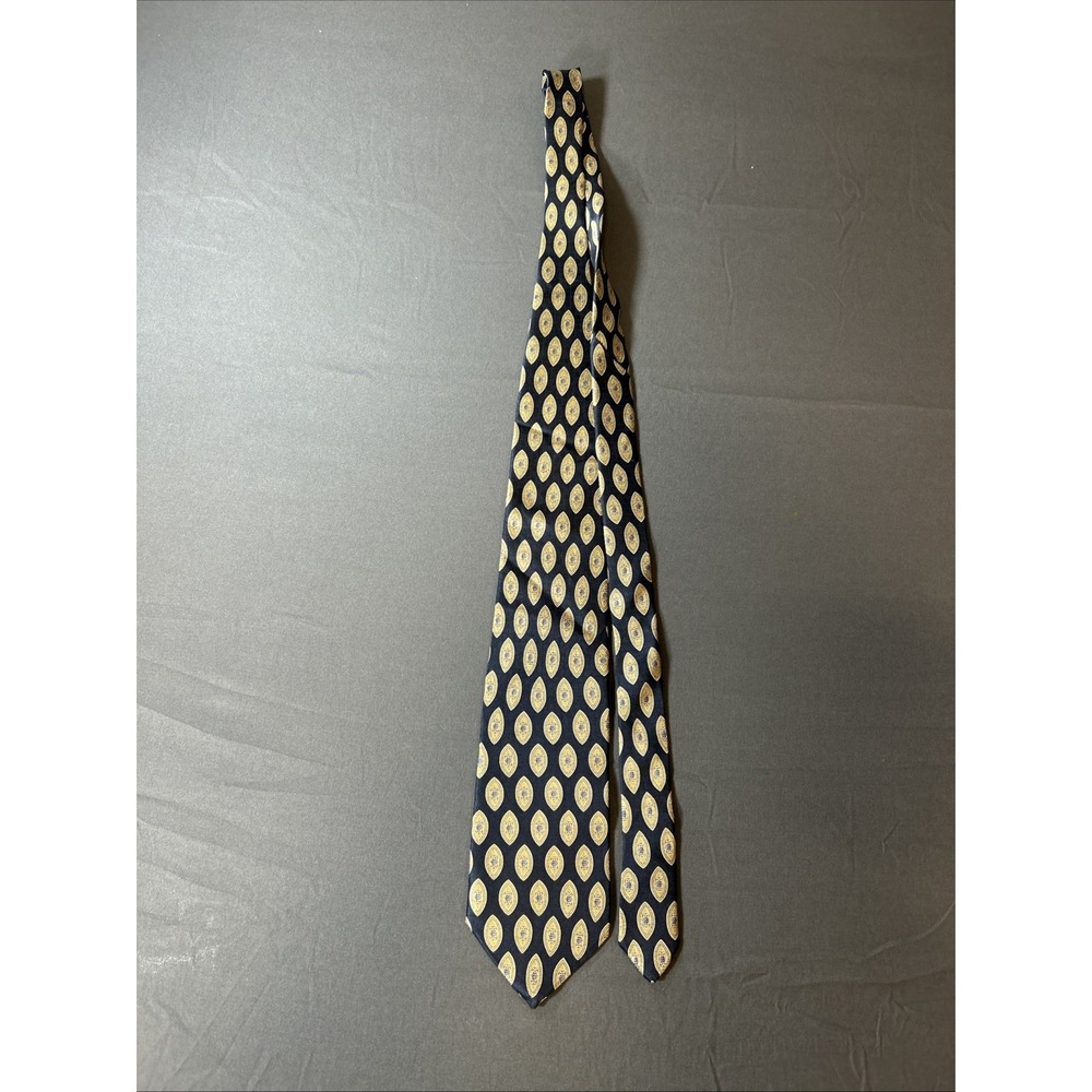 vintage Puritan navy blue necktie featuring an intricate gold and blue